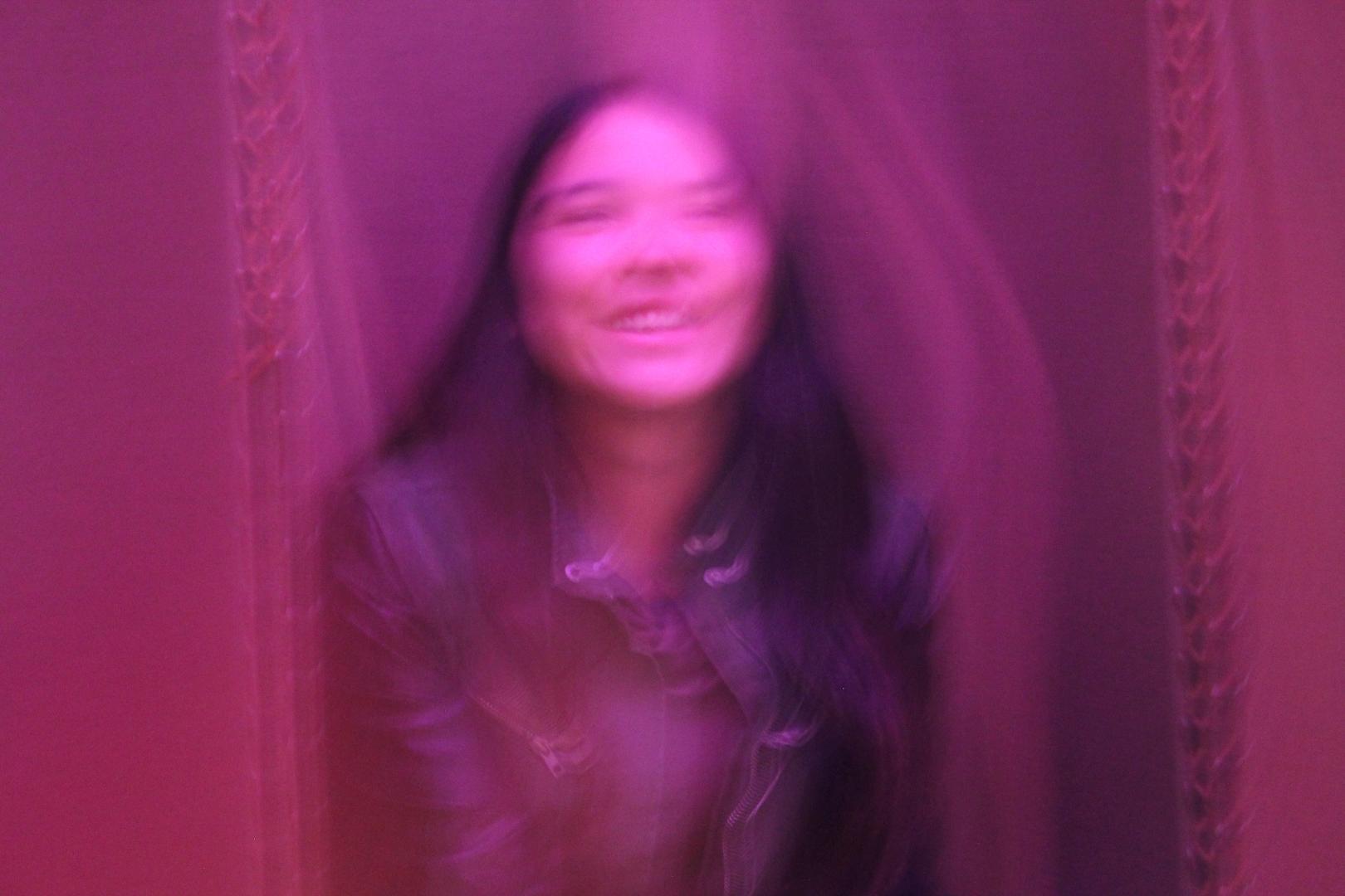 Young woman, as a blurred image