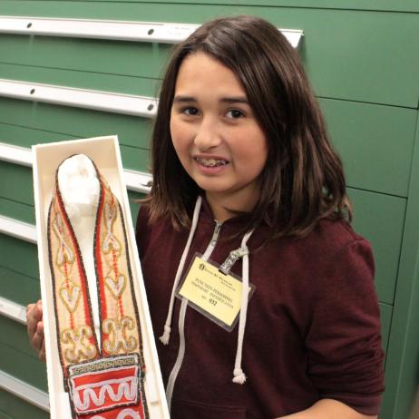 Youth, holding a Tahltan dagger shealth
